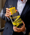 Eau de Parfum Danger Barba Forte sendo retirado da lata de apresentação por homem de terno